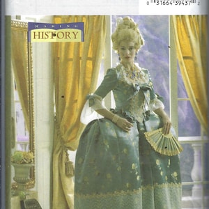 May include: A vintage sewing pattern for a historical costume, featuring a woman in a teal gown with floral accents and a fan. The pattern is labeled "B4485 Butterick" and includes the text "MAKING HISTORY". The size is AA (6-8-10-12).