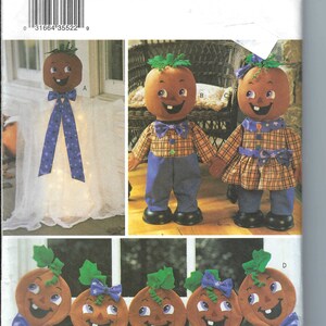 May include: A sewing pattern for making pumpkin-themed decorations. The pattern includes instructions for making a light-up pumpkin, two pumpkin dolls, and a garland of five pumpkins. The pattern is from Butterick and has the number 3618.