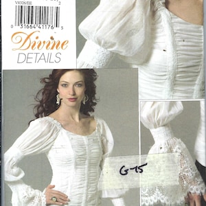 May include: White blouse pattern with a square neckline, gathered bodice, and bell sleeves with lace trim. The pattern includes the text "Divine DETAILS" and "VOGUE". The pattern number is V8326.