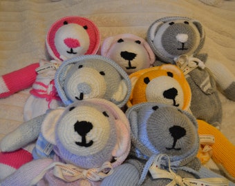 Cuddly hand knitted teddy bears. Each one comes with removable clothes, a name label and gift bag. Bears are approximately 45cm long.
