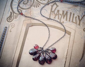 Rustic garnet cluster necklace on oxidized sterling