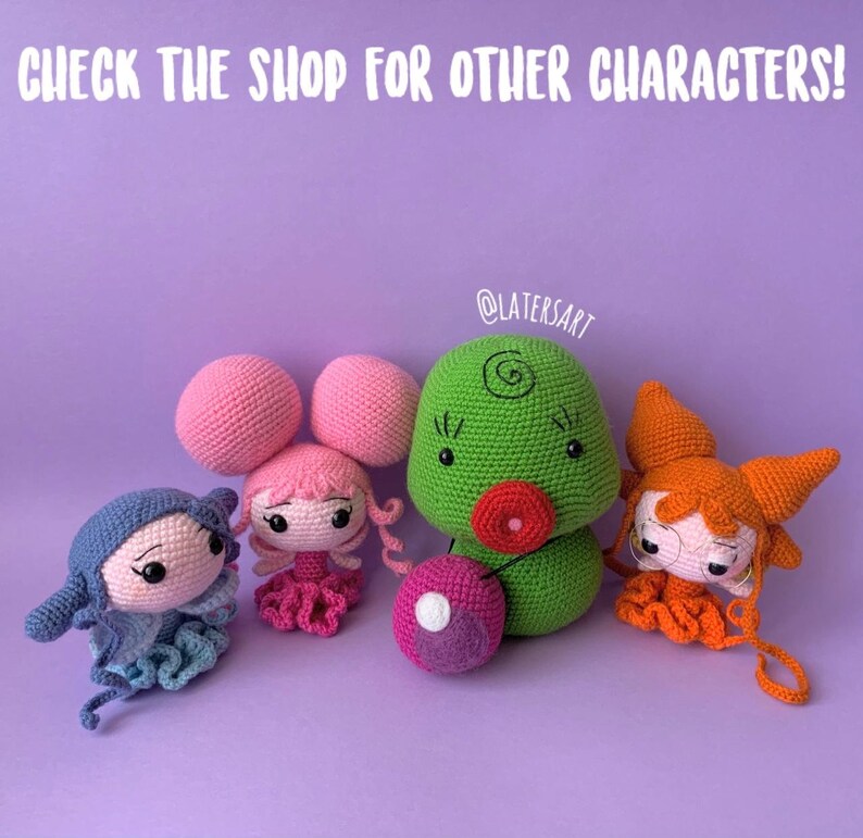 May include: Four handmade crochet dolls featuring distinct designs: a blue figure, a pink character with large round hair buns, a green rounded creature with a red mouth, and an orange figure with glasses. Text reads: CHECK THE SHOP FOR OTHER CHARACTERS!