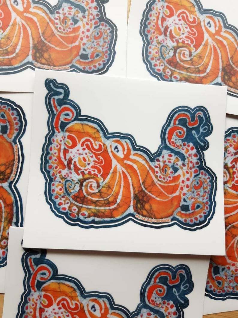 May include: Orange and blue octopus sticker with a batik design. The octopus is outlined in blue and has a white background.
