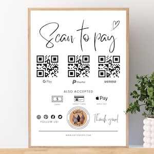 May include: A framed white sign with the text "Scan to pay" in elegant script, featuring QR codes for G Pay, PayPal, and Venmo. It also lists accepted payment methods: cash, credit card, and Apple Pay. The sign includes a logo and the words "Thank you!"