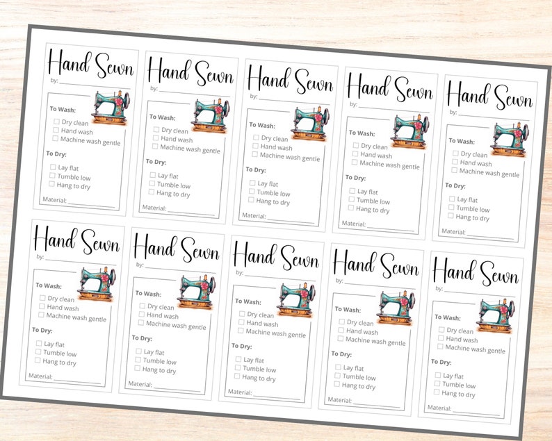 May include: Nine white printable tags with a black border and a sewing machine graphic. The tags have the text "Hand Sewn" at the top and include instructions for washing and drying. The text includes "To Wash:", "To Dry:", "Dry Clean", "Hand Wash", "Machine Wash Gentle", "Lay Flat", "Tumble Low", "Hang to Dry", and "Material".