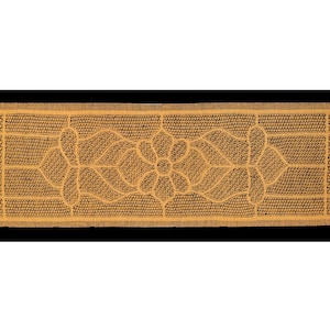 May include: A brown doormat with a geometric design featuring a repeating pattern of flower shapes. The doormat has a textured surface.