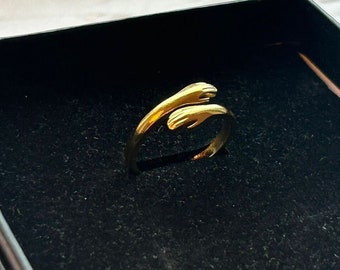 Anello HUGGING HANDS in acciaio inossidabile 316L argento/oro (impermeabile)