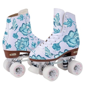 May include: White roller skates with blue floral and butterfly print. The skates have brown wheels with "Chicago Skates" written on them.