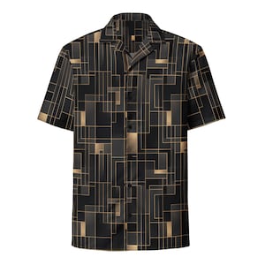 May include: Black and gold geometric patterned short-sleeve button-down shirt. The shirt features a repeating design of rectangular shapes in shades of black, gray, and gold. The shirt has a classic collar and button closure.