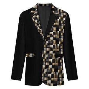 May include: A black blazer featuring a notched lapel and a two-button closure. The right side of the front panel and the lapel display a geometric pattern of gold, silver, and black squares, while the left side and sleeves remain solid black.