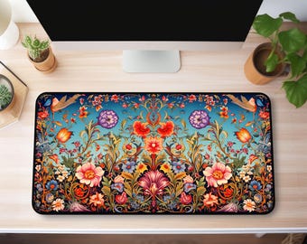 May include: A colorful floral patterned mousepad with a blue background. The pattern features intricate details of flowers, leaves, and vines.