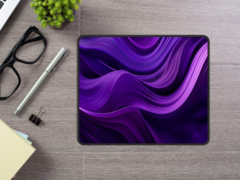 May include: Purple abstract design mouse pad with a wavy pattern.