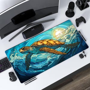 May include: A rectangular desk mat with a sea turtle design. The turtle has a brown shell and is swimming in blue ocean waves under a bright sun. The mat is on a white desk with a computer monitor, keyboard, and other accessories.