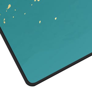 May include: A teal blue background with a black border. The background has a subtle speckled pattern of small gold dots.