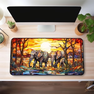 May include: A stained glass style illustration of three elephants walking in a line. The elephants are gray and brown with colorful details. The background is a sunset with a bright orange sun and trees. The image is on a black background.
