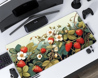 May include: A rectangular desk mat featuring a vibrant illustration of strawberries, white flowers, and green leaves. The design is set against a light green and dark background. The mat is designed to protect the desk surface.