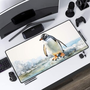 May include: A white and grey penguin with orange feet stands on a rock in a watercolour painting. The background is a light blue and white watercolour wash.
