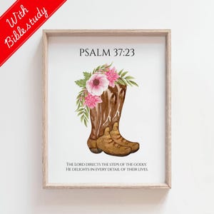 May include: A framed print featuring a watercolor illustration of a brown cowboy boot adorned with pink flowers and green leaves. The text "PSALM 37:23" is above the boot, and the scripture "THE LORD DIRECTS THE STEPS OF THE GODLY. HE DELIGHTS IN EVERY DETAIL OF THEIR LIVES." is below.