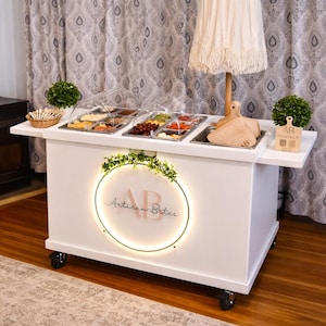 May include: A rustic wooden sign with the text "Welcome to our home" in white lettering. The sign features a distressed finish and a simple, inviting design, perfect for a front porch or entryway.