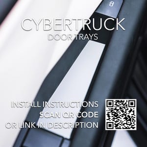 May include: A close-up of a black door panel with a white insert. The insert has the text "CYBERTRUCK DOOR TRAYS" and a QR code with the text "INSTALL INSTRUCTIONS SCAN QR CODE OR LINK IN DESCRIPTION".