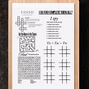 Könnte beinhalten: Ein ausdruckbares Arbeitsblatt mit Spielen und Aktivitäten zum Thema Essen. Das Arbeitsblatt enthält ein Kreuzworträtsel, ein Suchwort, ein Labyrinth, ein Tic-Tac-Toe-Spiel und ein Ich-sehe-Spiel. Das Arbeitsblatt ist schwarzweiß und hat einen hellbraunen Holzrahmen.