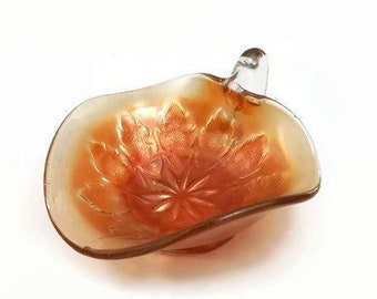 Dugan carnival glass nappy dish, iridescent marigold