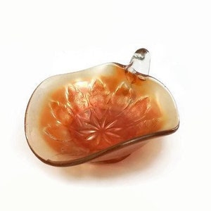 Dugan carnival glass nappy dish, iridescent marigold image 1