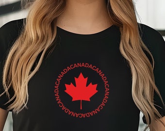 May include: Black t-shirt with a red maple leaf and the word "CANADA" repeated in a circle around the leaf.