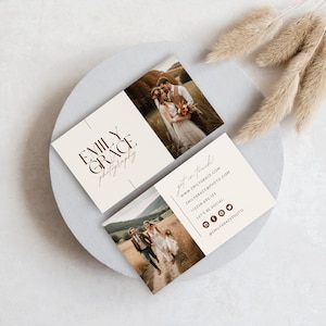 May include: A beige business card with brown text that reads "EMILY GRACE photography" and a photo of a couple in a field. The back of the card has contact information, including a website, email address, phone number, and social media handles.
