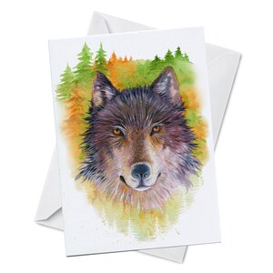 May include: Watercolor painting of a wolf's face with a forest background. The wolf has brown fur and yellow eyes. The forest is painted in shades of green, yellow, and orange.