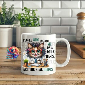 May include: White ceramic coffee mug with a colorful illustration of a cat wearing glasses and a doctor's coat. The text on the mug reads "People who tolerate me on a daily basis... are the real heros".