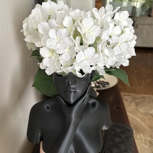Female upper body vase