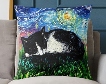 May include: A black and white cat sleeping in a field of green grass. The background is a blue and yellow starry night sky.