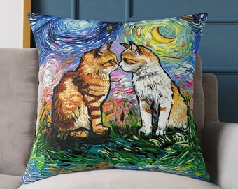 May include: A throw pillow with a colorful, abstract painting of two cats kissing. The background is a swirling blue and purple sky with a yellow moon.