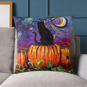 May include: A black cat sits on top of a large orange pumpkin with two smaller pumpkins on either side. The background is a purple and blue starry night sky with a crescent moon.