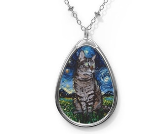 May include: A silver chain necklace with a teardrop-shaped pendant featuring a painting of a tabby cat in a starry night scene.