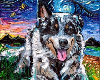 May include: A painting of a blue heeler dog in a starry night landscape. The dog is lying down with its tongue sticking out. The background is a swirling blue sky with a yellow moon and stars. The painting is done in a style reminiscent of Vincent van Gogh.