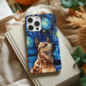 May include: A phone case featuring a dog portrait set against a starry night sky, reminiscent of Van Gogh's style. The case has a dark blue background with swirling yellow and white stars. The dog is brown and white.