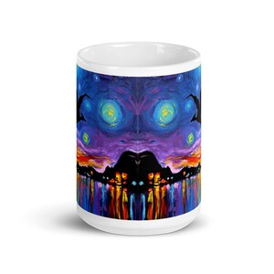 May include: White ceramic mug with a colorful abstract design. The design features a dark silhouette of a city skyline with a purple and blue sky with yellow stars. The bottom of the mug features a reflection of the city lights in the water.