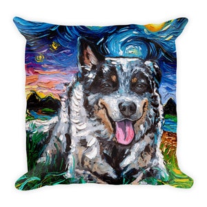 May include: A blue heeler dog with a white and brown coat is painted in a style reminiscent of Vincent van Gogh's Starry Night. The dog is lying down with its tongue sticking out and has a happy expression on its face. The background is a swirling blue and yellow sky with stars and a green field.