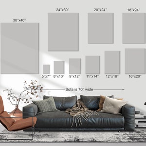 May include: A display of various sized blank canvas art prints, including 30"x40", 24"x30", 20"x24", 18"x24", 16"x20", 12"x18", 11"x14", 9"x12", 8"x10", and 5"x7". The sofa is 70" wide.