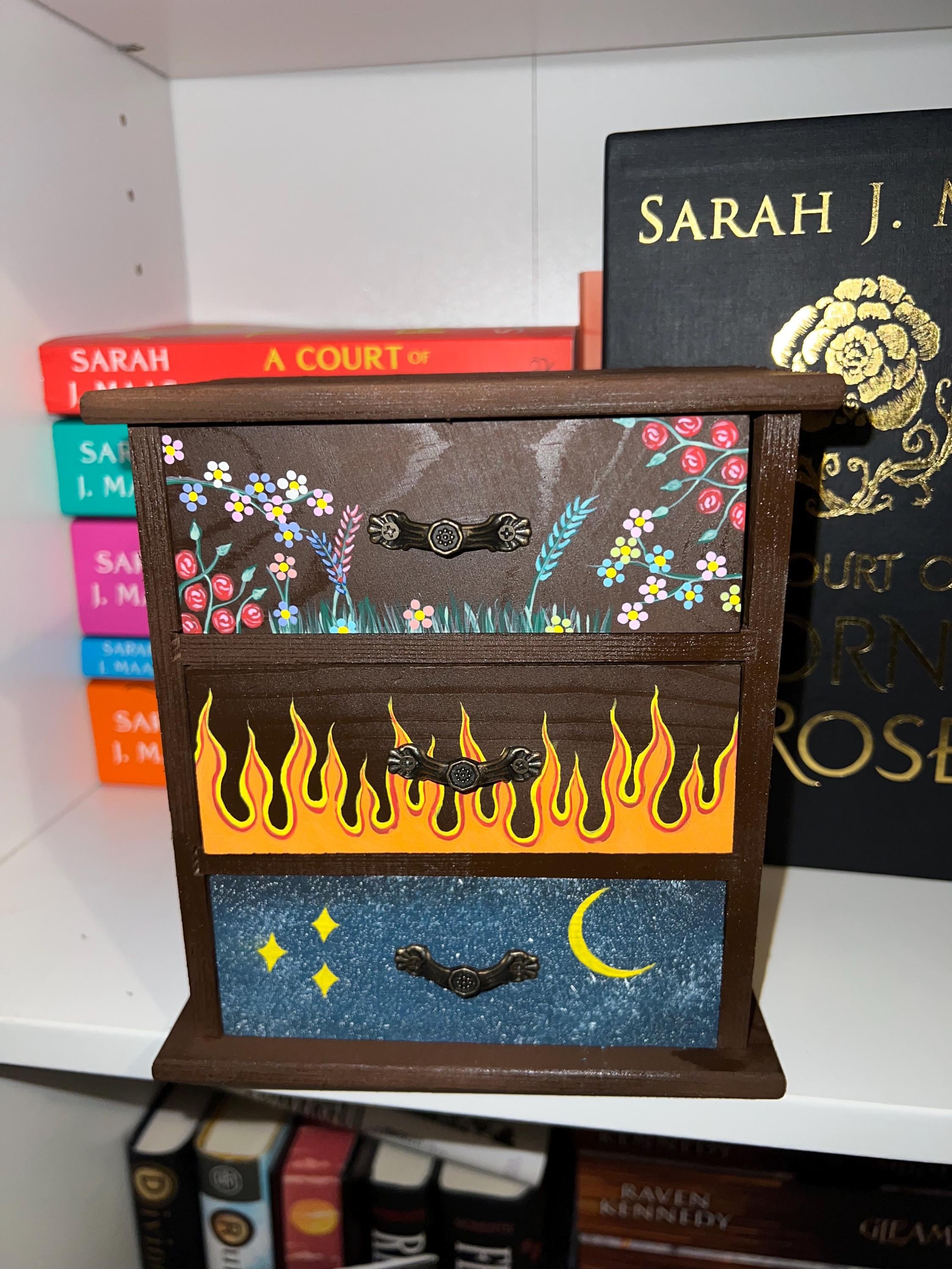 acotar dresser Feyre Archeron painting the dresser.  Stars, Flames, Flowers : Three symbols that would end up meaning so much more than she could ever imagine. #acotar #feyrearcheron #acotarseries inch hard enamel pin ACOTAR Dresser, Hand Painted! -