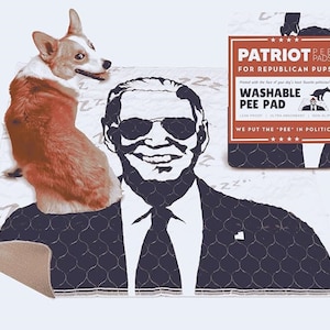 May include: A white and blue washable pee pad with a black and white image of a man wearing sunglasses and a suit. The text on the pad reads "Patriot Pee Pads for Republican Pups" and "We put the "pee" in politics".