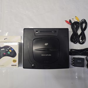 Sega Saturn Works Great!! Comes with a New Controller and HDMI Hookups 60-Day Warranty