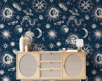 May include: A wooden cabinet with a woven rattan front, featuring two drawers and two doors. The cabinet is set against a dark blue background with a repeating pattern of celestial bodies, including stars, moons, and suns.