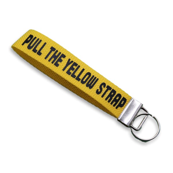 Llavero de pulsera con tirador amarillo / Accesorio icónico para bolso inspirado en el parque Disney
