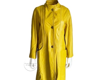May include: A long yellow leather coat with a stand-up collar, button closure, and two pockets.