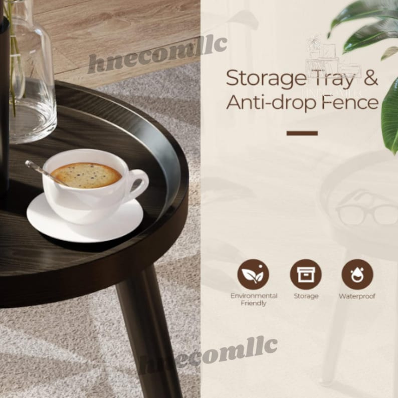 May include: A black round side table with a storage tray and an anti-drop fence. The table has three black legs and a cup of coffee on the tray. The text "Storage Tray & Anti-drop Fence" is written in brown text on a white background. The text "Environmental Friendly", "Storage", and "Waterproof" is written in black text on white circles with icons.