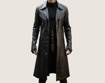 May include: A long black leather coat with a button closure and a pointed collar. The coat has a zipper detail on the front and a chain detail on the inside.