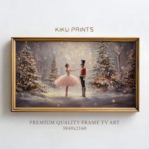 May include: A framed illustration of a ballerina in a pink tutu dancing with a toy soldier in a red uniform. The scene is set in a snowy forest with twinkling lights on the trees. The text "Kiku Prints" appears above the image and "PREMIUM QUALITY FRAME TV ART 3840x2160" appears below the image.